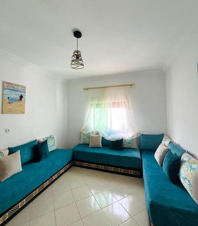Posezení v ubytování Appartement centre oued laou avec piscine été