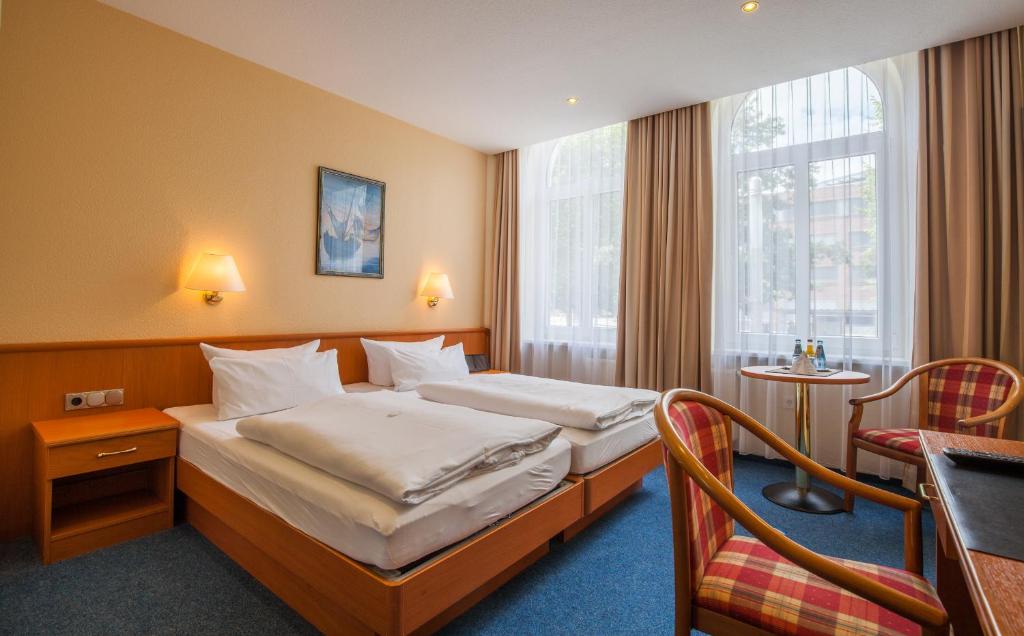 Postel nebo postele na pokoji v ubytování Sure Hotel by Best Western Wilhelmshaven City