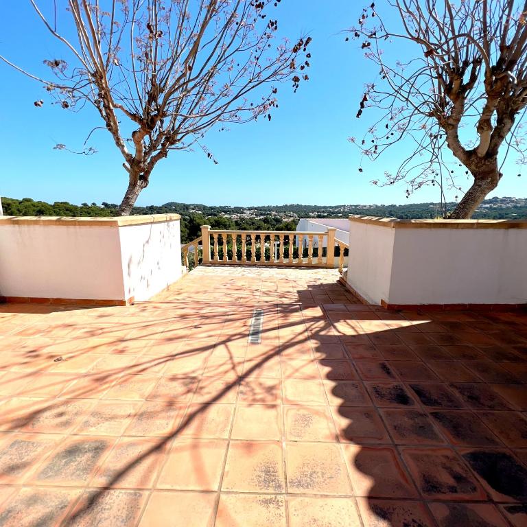 a view from the roof of a house with two trees at Villas Monte Jávea - BTB in Jávea