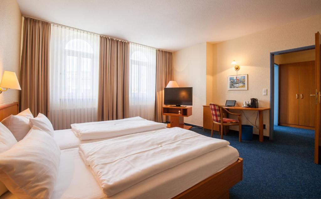 Postel nebo postele na pokoji v ubytování Sure Hotel by Best Western Wilhelmshaven City