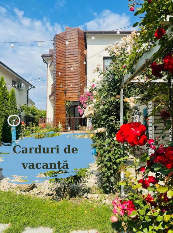a sign for a garden in front of a building at Vila Viorica in Mamaia Sat/Năvodari