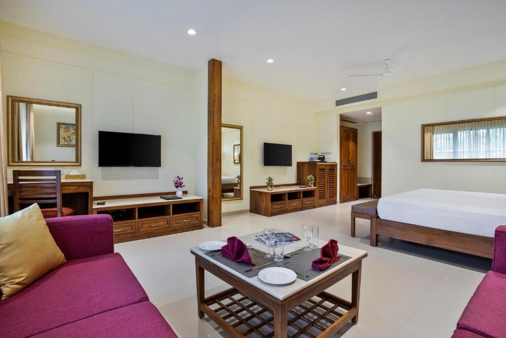 TV a/nebo společenská místnost v ubytování Seashell Suites and Villas- Candolim Goa
