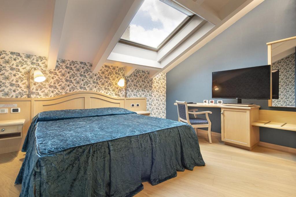 Postel nebo postele na pokoji v ubytování Hotel Luis