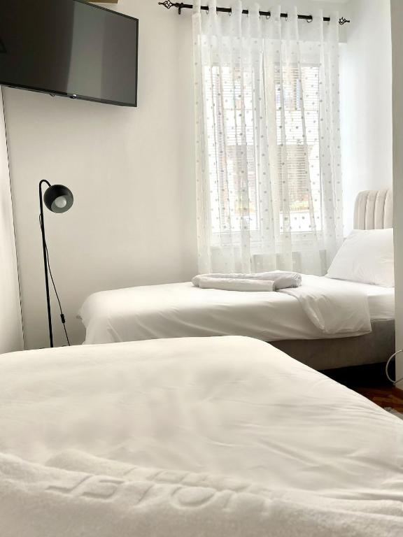 Postel nebo postele na pokoji v ubytování Lumo