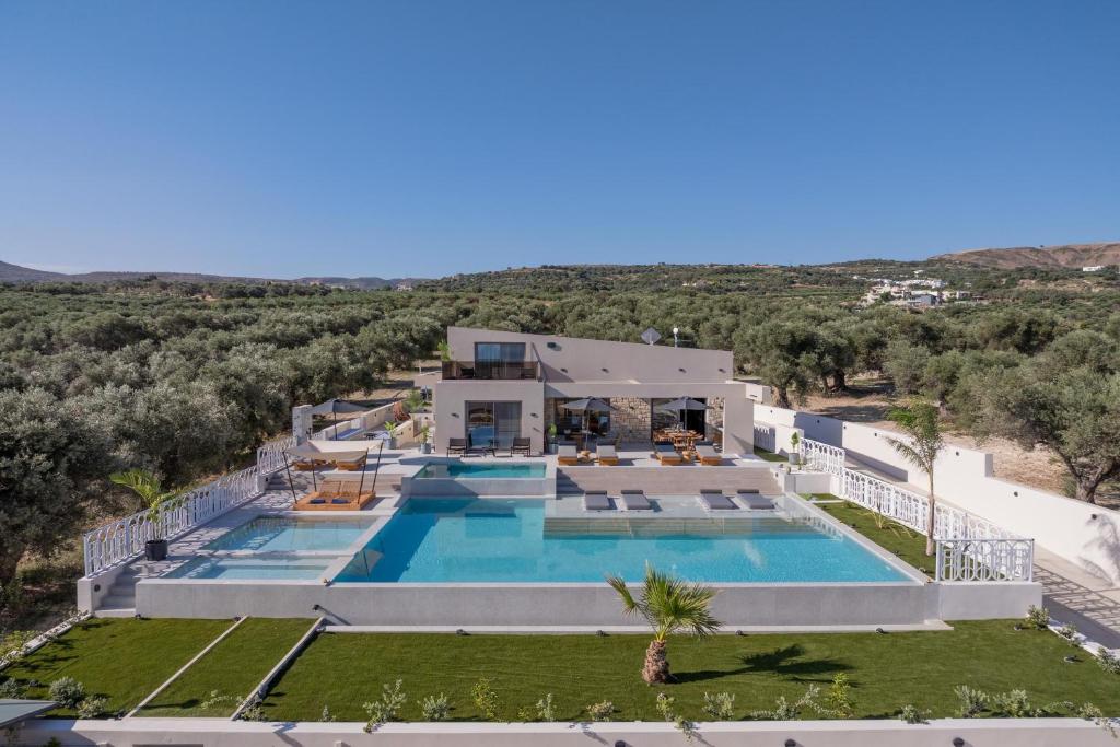 an aerial view of a villa with a swimming pool at Bliss Villas in Rethymno Town