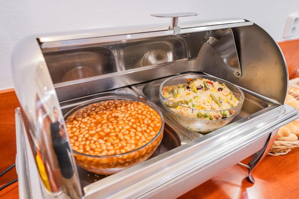 a refrigerator with three bowls of food in it at City Central De Luxe in Prague
