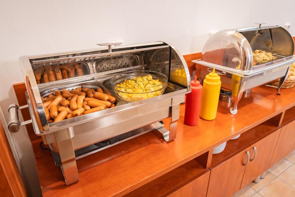 a buffet with many different types of food at City Central De Luxe in Prague