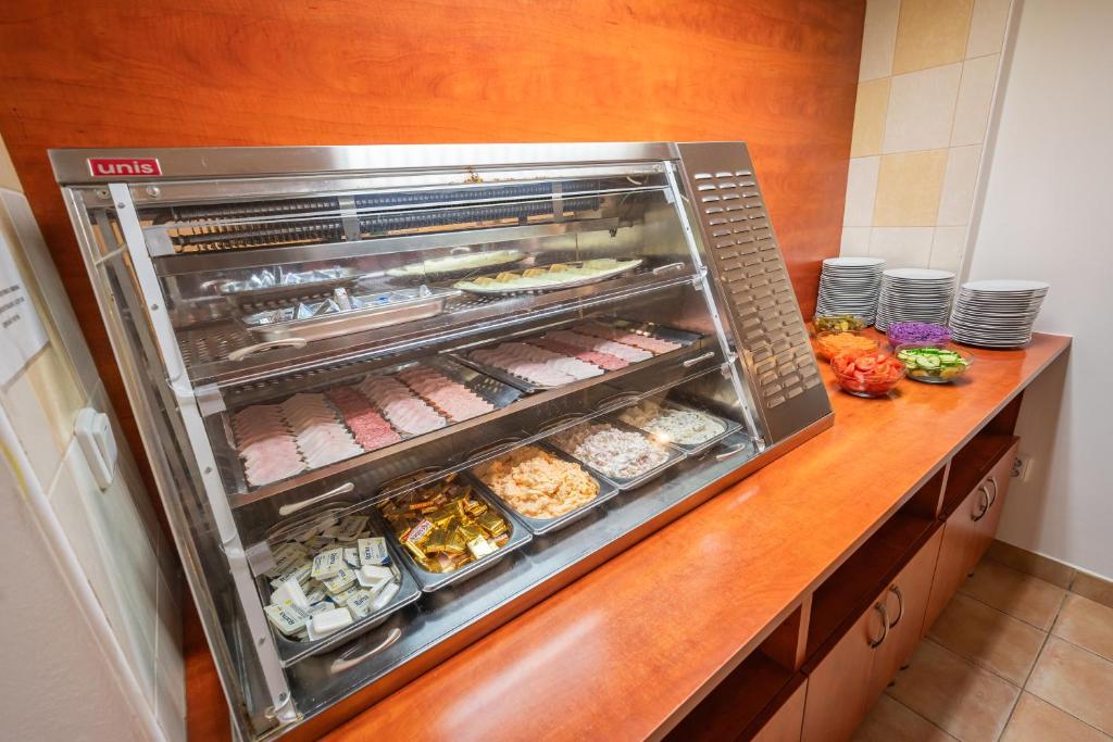 a kitchen with an oven with food in it at City Central De Luxe in Prague