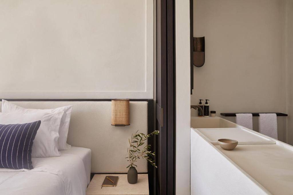 Postel nebo postele na pokoji v ubytování Anandes Hotel