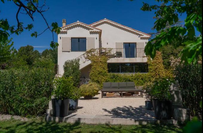 a house with a bench in front of it at Maison familiale avec piscine in Aix-en-Provence