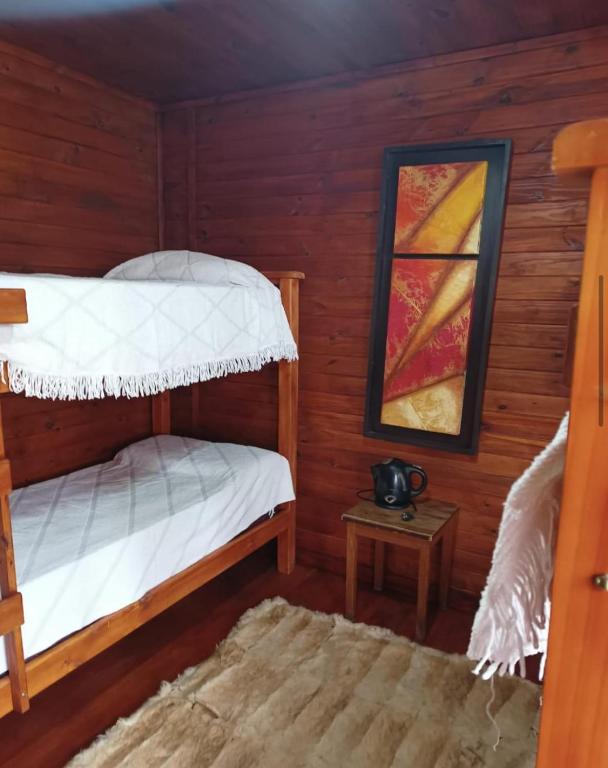 Postel nebo postele na pokoji v ubytování Cabañas kapo team