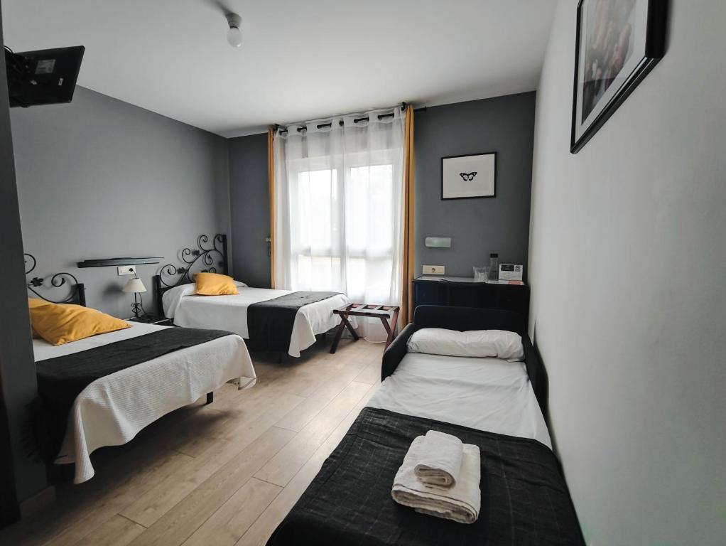 Posteľ alebo postele v izbe v ubytovaní Nest El Camino