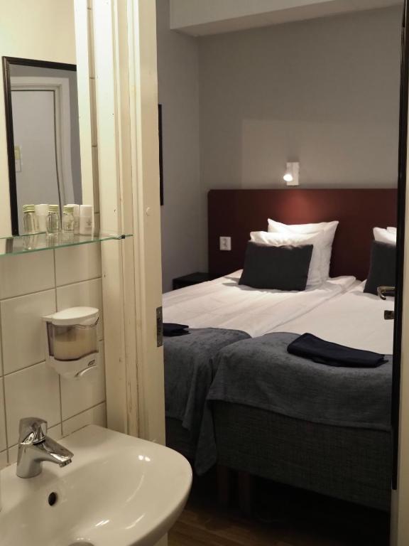 Postel nebo postele na pokoji v ubytování Hotel Söder