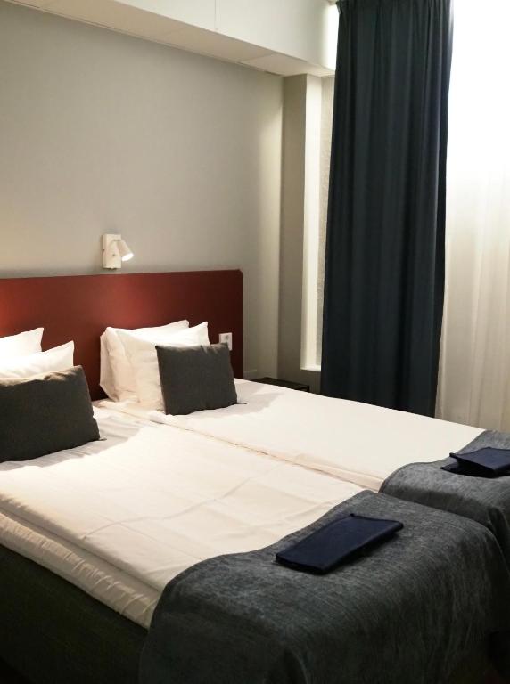 Postel nebo postele na pokoji v ubytování Hotel Söder