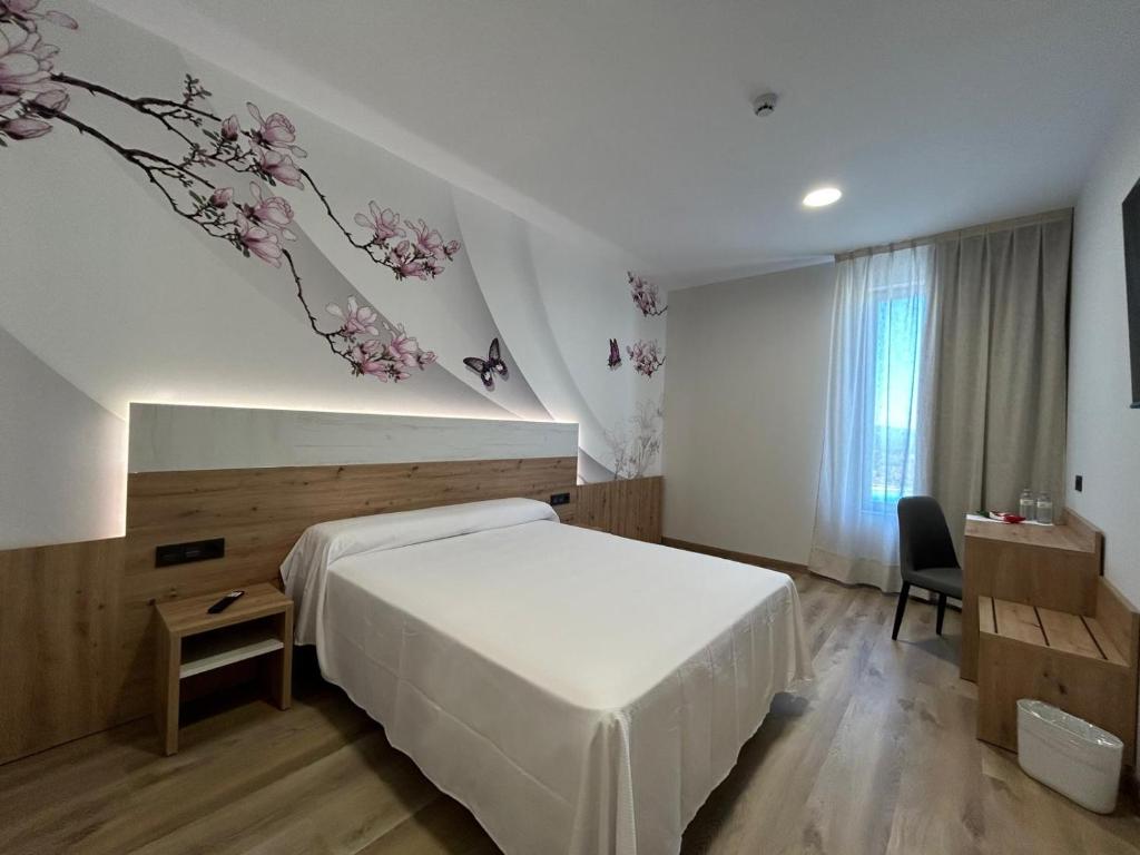 Postel nebo postele na pokoji v ubytování Hotel Javalambre
