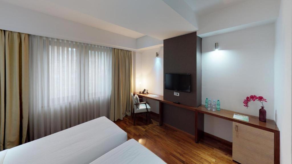 Postel nebo postele na pokoji v ubytování City5 ROOMS & SUITES by LSA