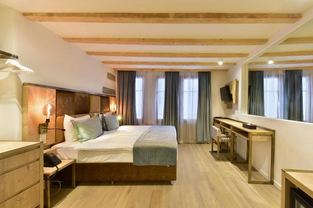 Postel nebo postele na pokoji v ubytování Hotel Rousseau
