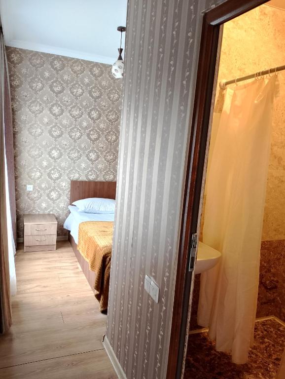 Postel nebo postele na pokoji v ubytování Guest House on V. Pshavela 50