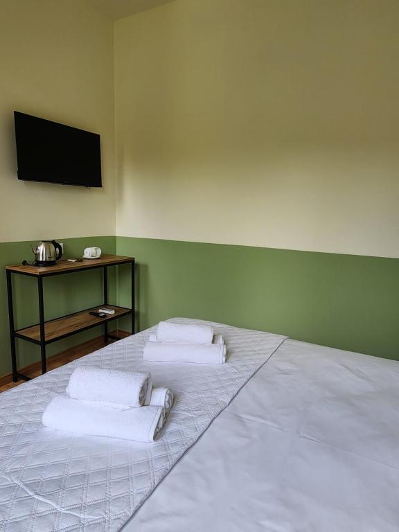 Postel nebo postele na pokoji v ubytování DRO Hotel