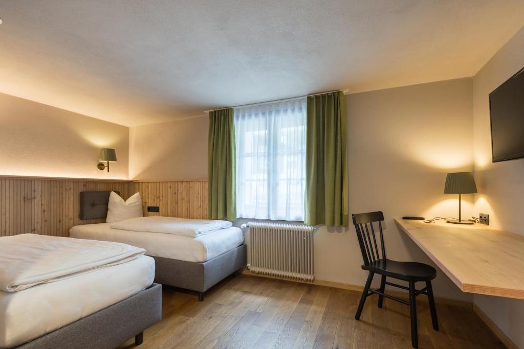 Postel nebo postele na pokoji v ubytování Hotel Sonne