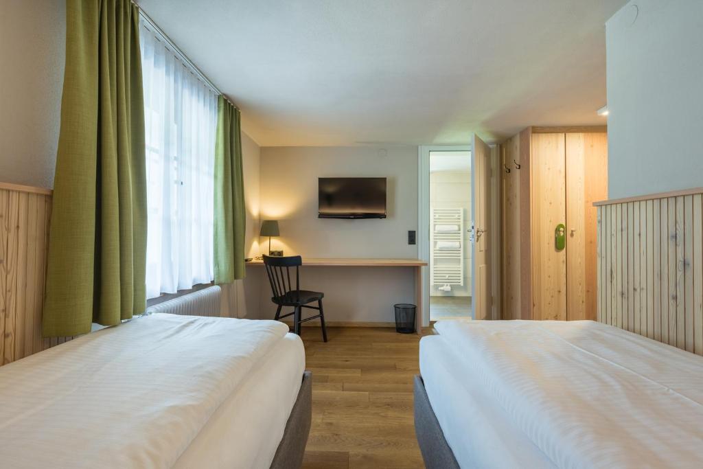 Postel nebo postele na pokoji v ubytování Hotel Sonne