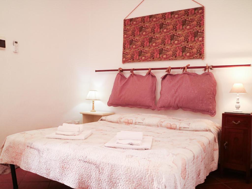 Łóżko lub łóżka w pokoju w obiekcie Agriturismo Il Masseto
