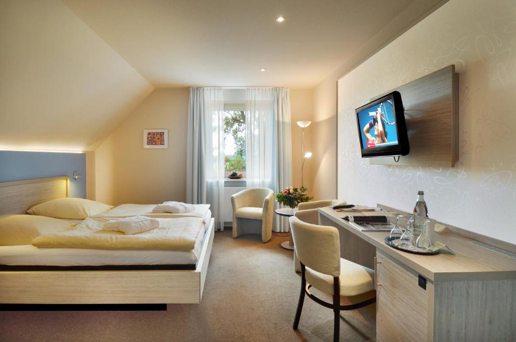 TV a/nebo společenská místnost v ubytování Akzent Hotel Haus Surendorff