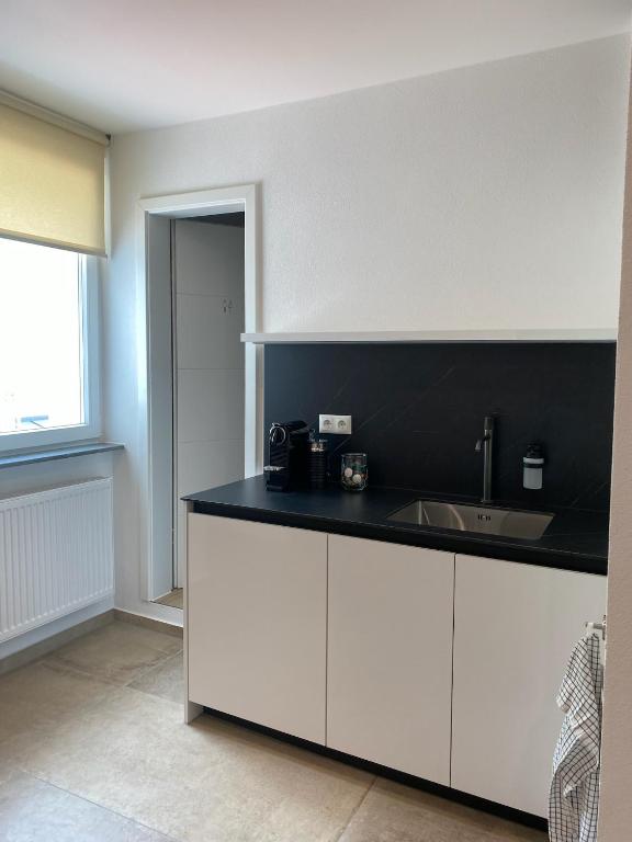 Kuchyň nebo kuchyňský kout v ubytování JetaHome