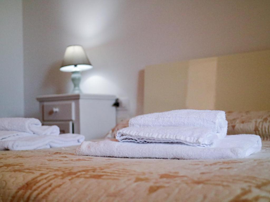 Łóżko lub łóżka w pokoju w obiekcie Agriturismo Il Masseto