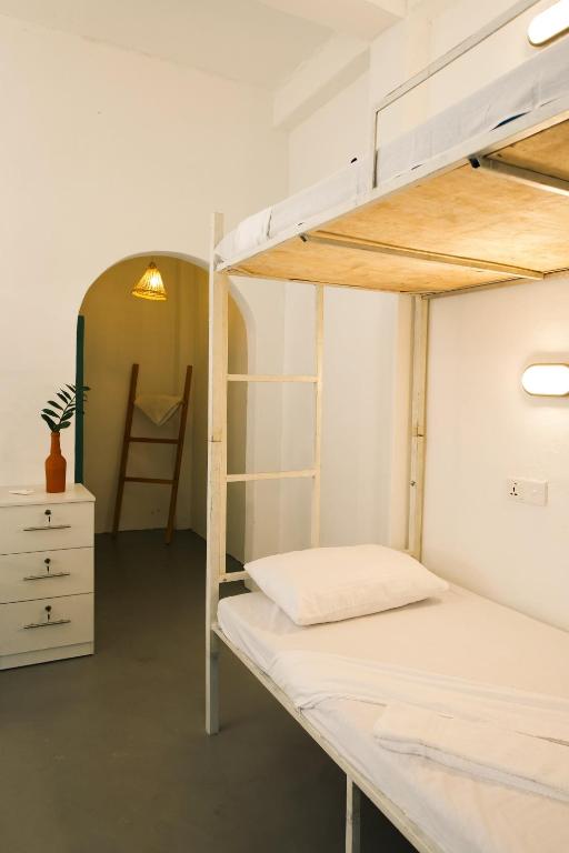 Postel nebo postele na pokoji v ubytování Fins Arugambay