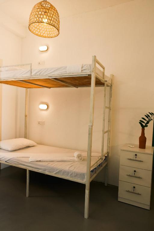 Postel nebo postele na pokoji v ubytování Fins Arugambay