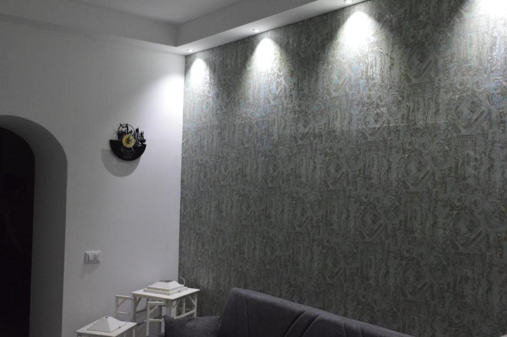 Area soggiorno di Adriano's Rooms