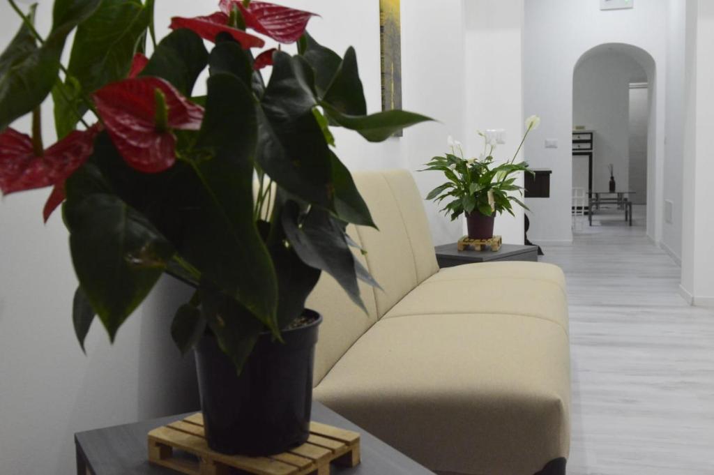 Area soggiorno di Adriano's Rooms