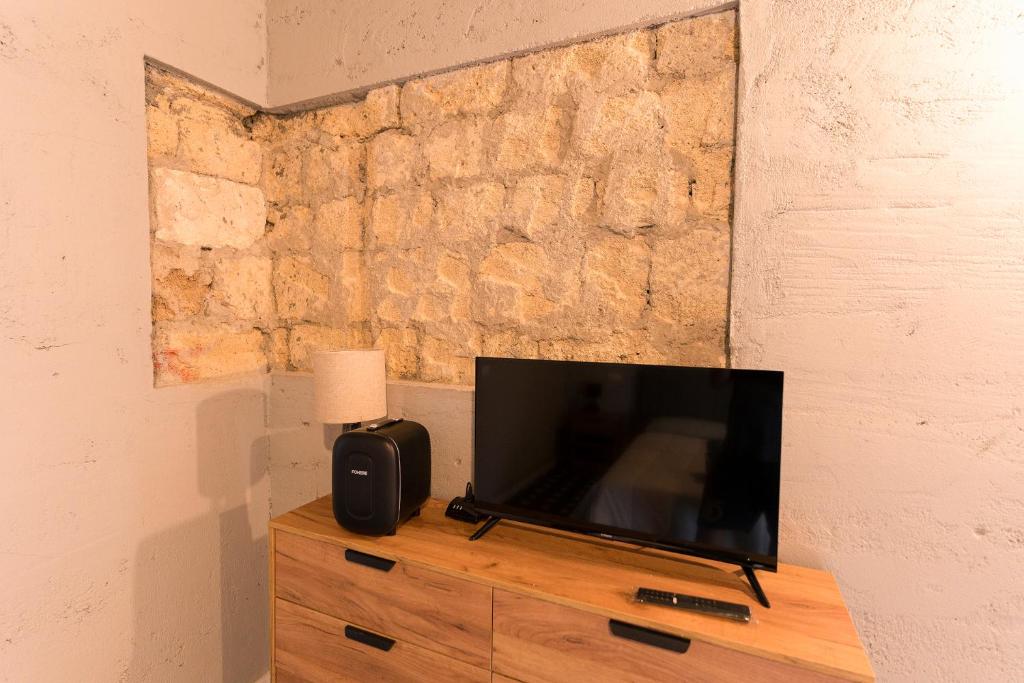 TV a/nebo společenská místnost v ubytování Due chicchi d'infinito