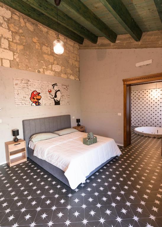 Postel nebo postele na pokoji v ubytování Due chicchi d'infinito