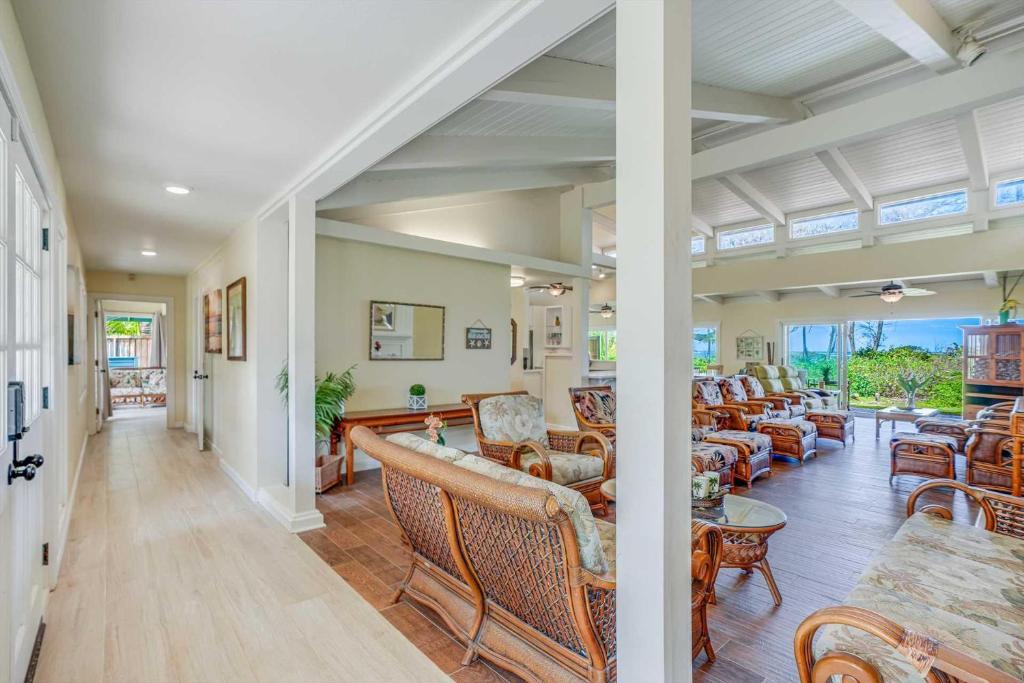 a living room with couches and chairs at Anahola Beach House 6br in Anahola