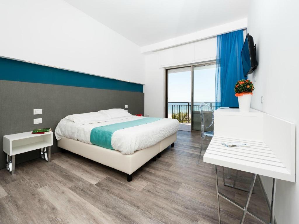 Postel nebo postele na pokoji v ubytování Hotel Serapo