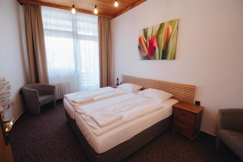 Postel nebo postele na pokoji v ubytování Pension Mona