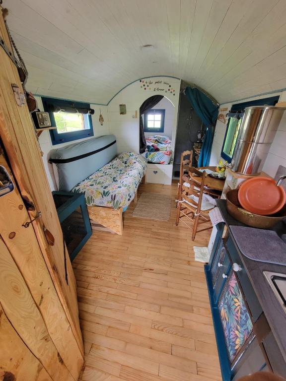 Postel nebo postele na pokoji v ubytování La roulotte tiny house du Mond'idéal