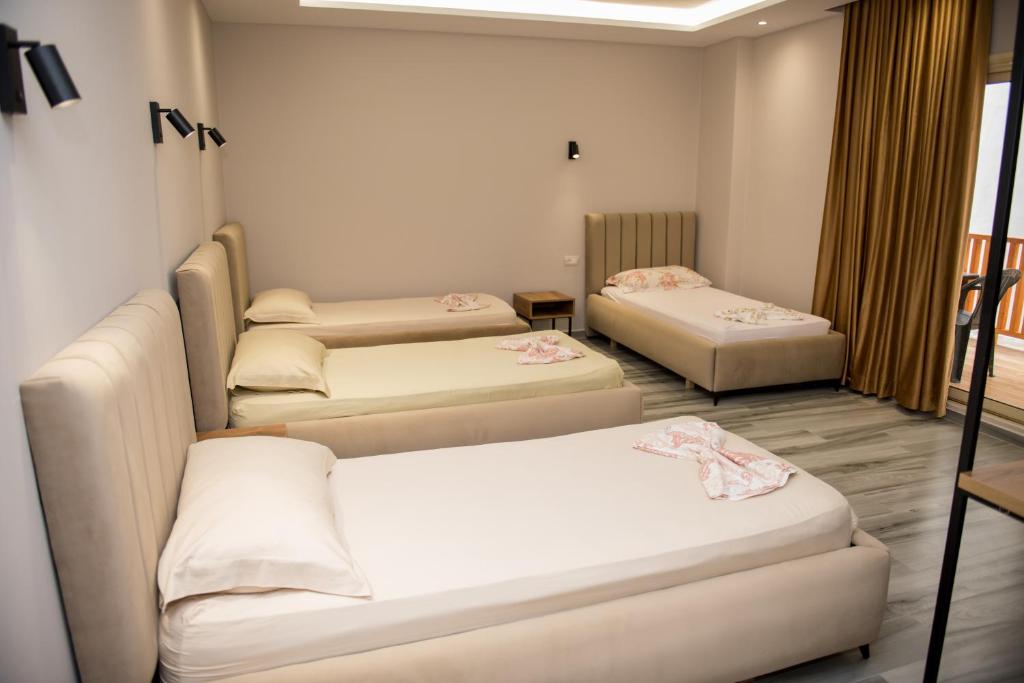 Postel nebo postele na pokoji v ubytování New Donantelo Hotel