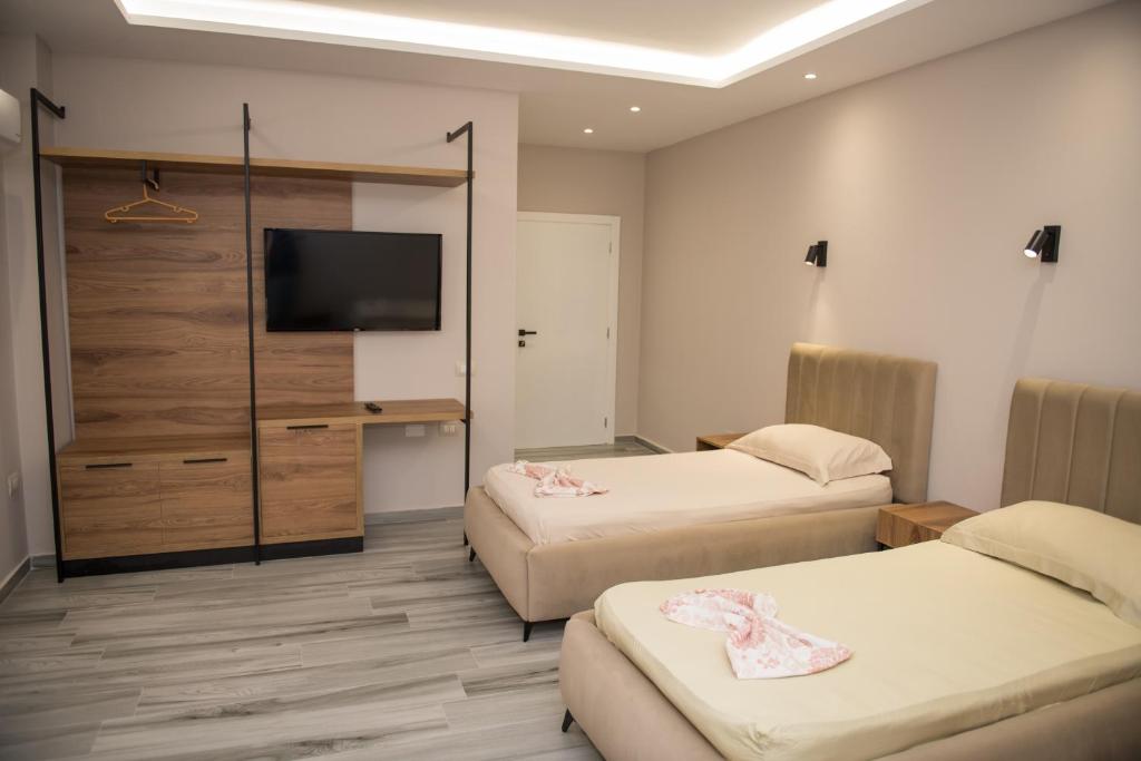 Postel nebo postele na pokoji v ubytování New Donantelo Hotel