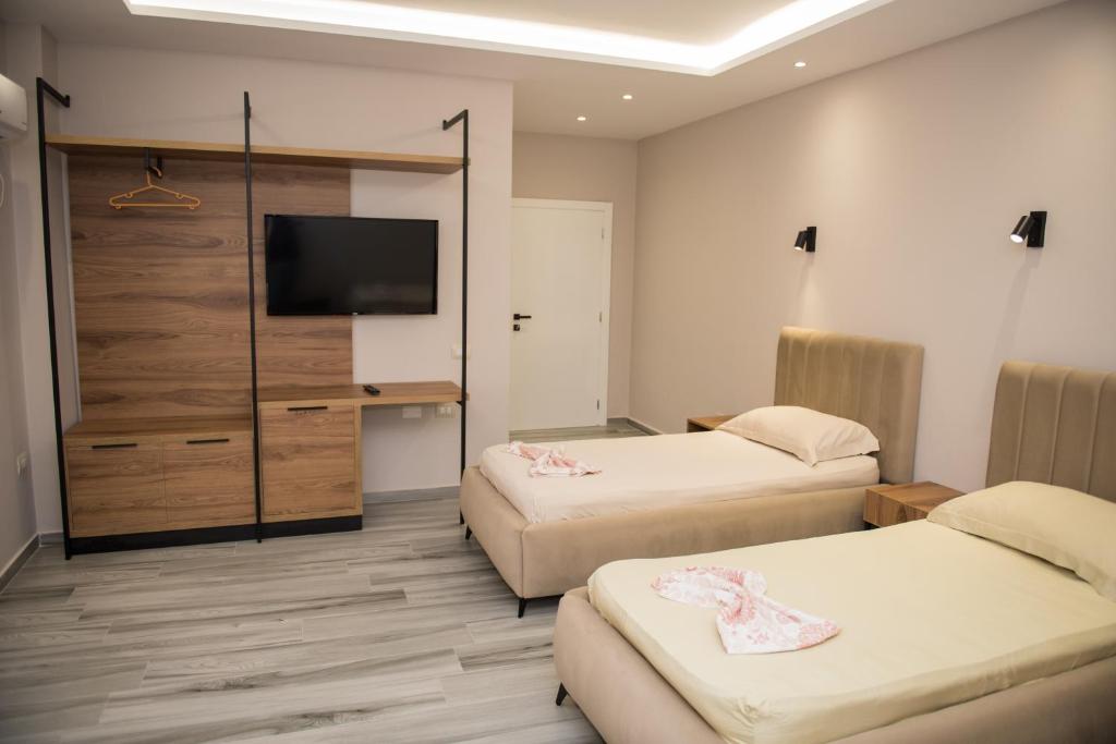 Postel nebo postele na pokoji v ubytování New Donantelo Hotel
