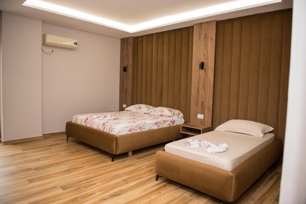 Postel nebo postele na pokoji v ubytování New Donantelo Hotel