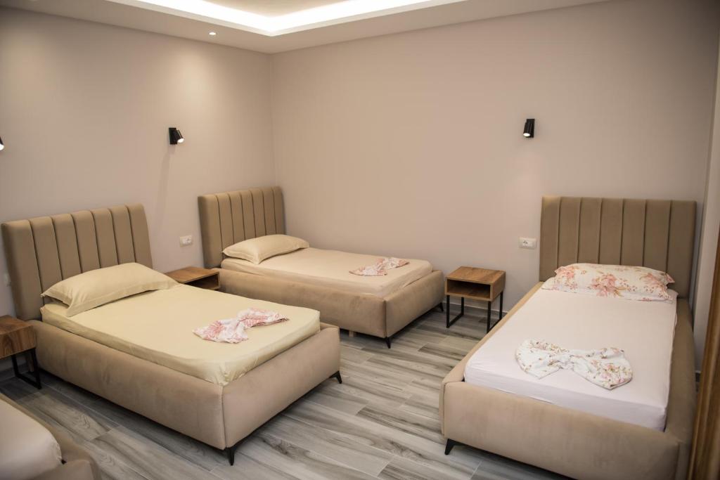 Postel nebo postele na pokoji v ubytování New Donantelo Hotel