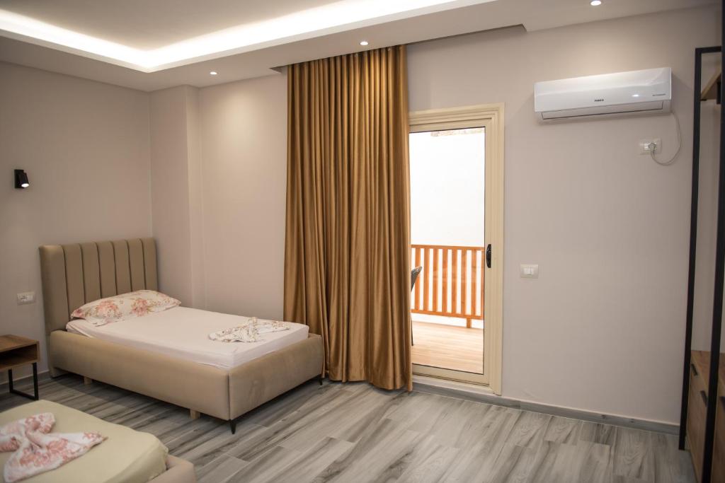 Postel nebo postele na pokoji v ubytování New Donantelo Hotel