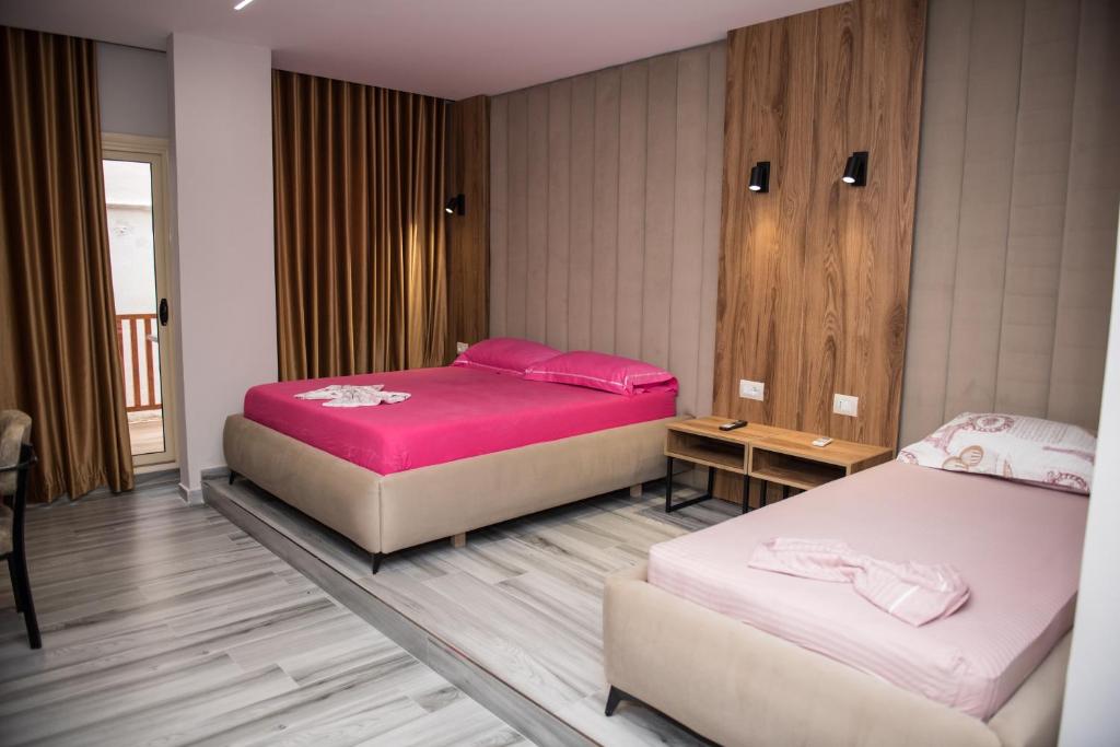 Postel nebo postele na pokoji v ubytování New Donantelo Hotel
