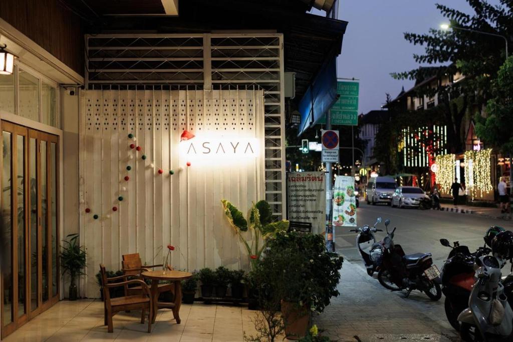 aiya sign on the side of a building on a street at ASAYA House in Chiang Mai