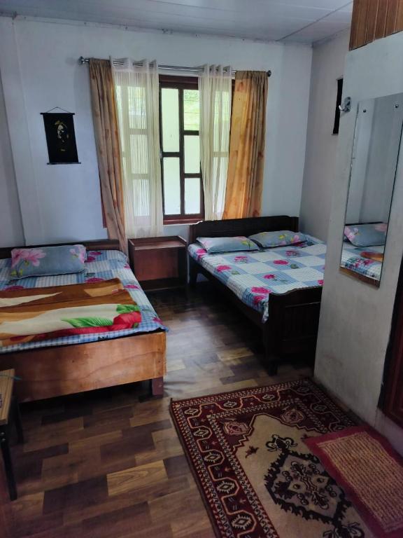 Postel nebo postele na pokoji v ubytování Yuven House