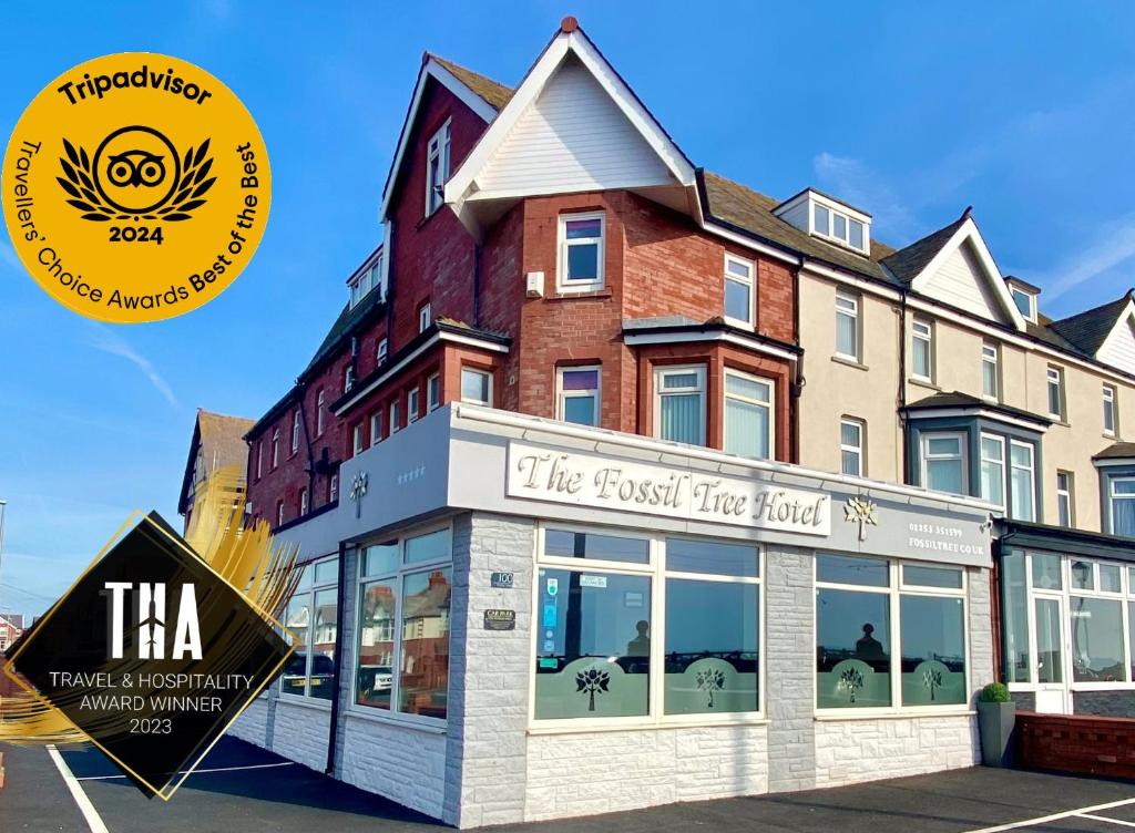 a first fire hotel with a sign in front of it at The Fossil Tree Hotel in Blackpool