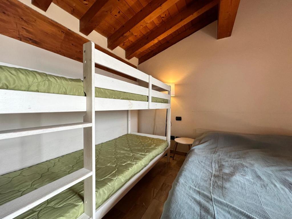 Postel nebo postele na pokoji v ubytování LOFT GARDASEE